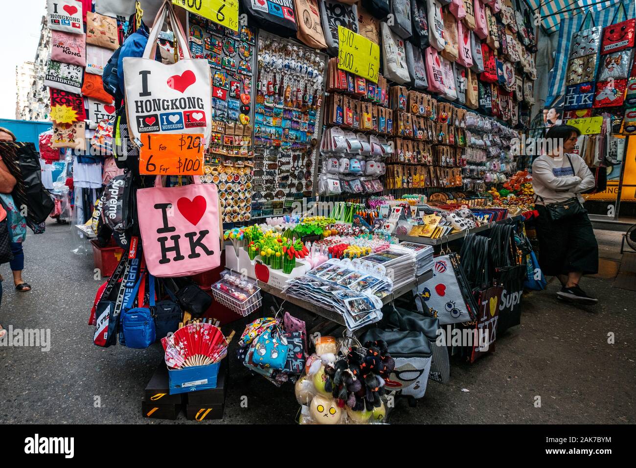HongKong, China - November, 2019: Fashion, bags, clothing and merchandise on street market (Ladie`s Market) in Hong Kong   , Tung Choi Street Stock Photo